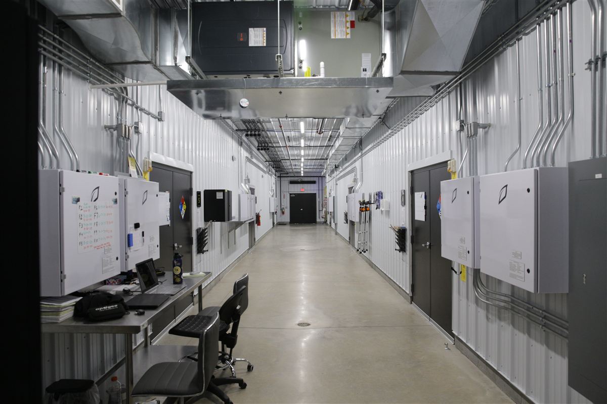 Commercial cultivation facility hallway with Growlink control panels